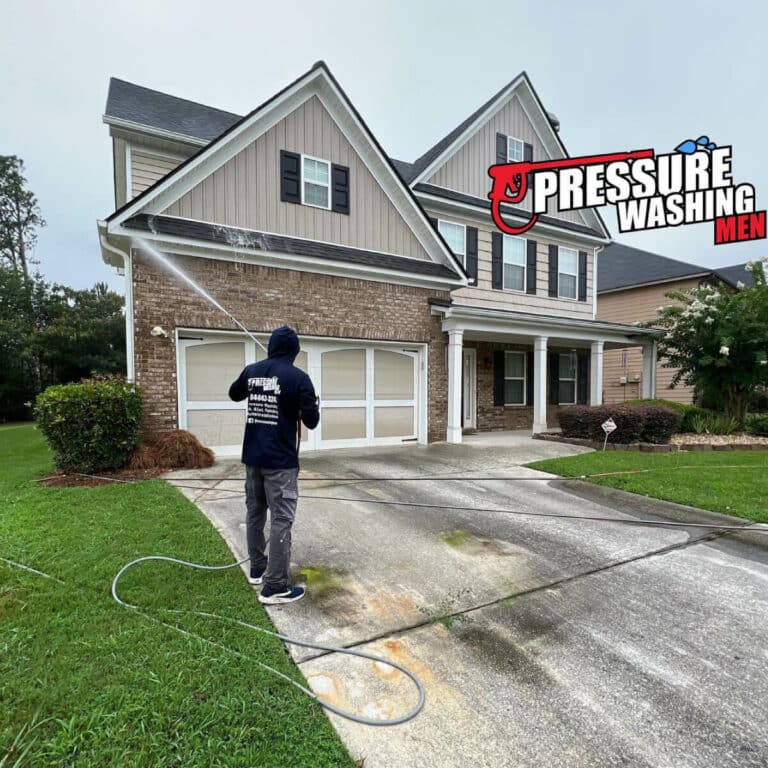 Pressure washing professional cleaning house exterior wall in lawrenceville georgia