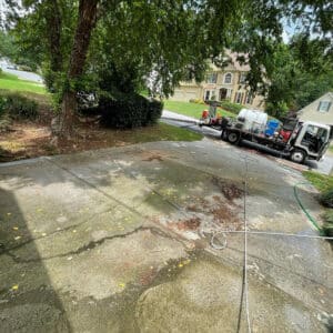 dirty residential driveway before pressure washing service in sugar hill georgia